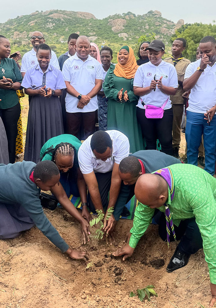 NUPA Team with students and leaders planting trees