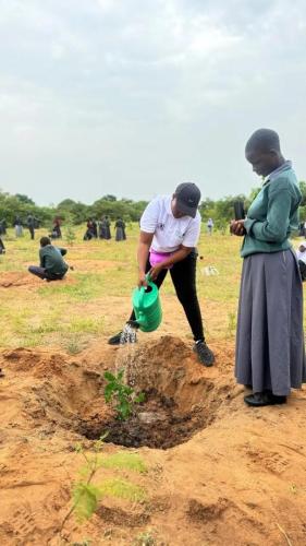 NUPA Leader watering a plant